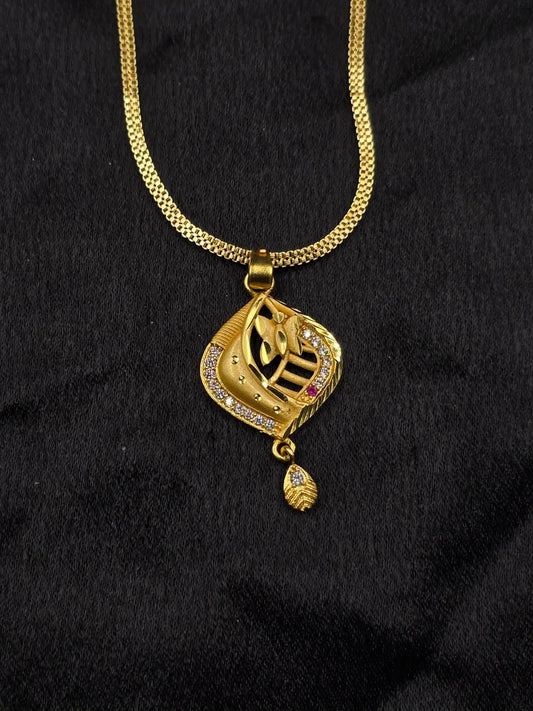 Gold necklace with a pendant on a black background