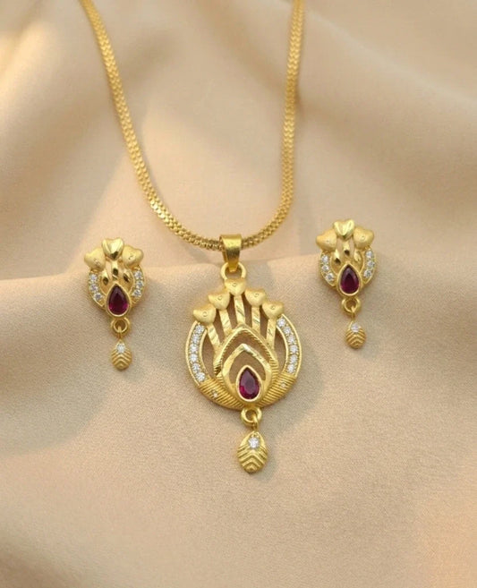 Gold necklace and earrings set on a mannequin