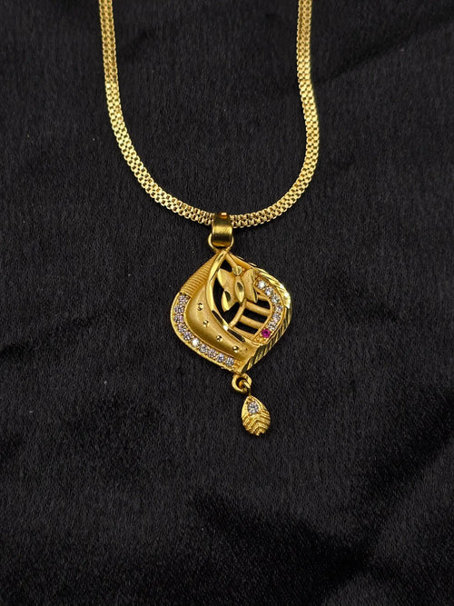 Gold necklace with a pendant on a black background